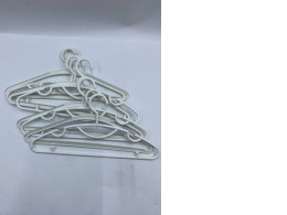 Set of  9 White plastic hangers 