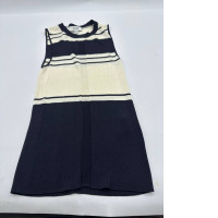 Women's cream-colored sleeveless shirt with black stripes 