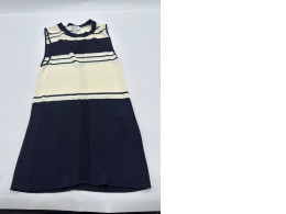 Women's cream-colored sleeveless shirt with black stripes 