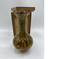 Brown glass vase in a wooden box