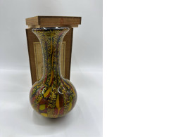 Brown glass vase in a wooden box