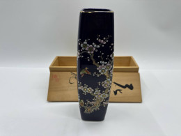Black glass vase with cherry blossom pattern in a wooden box 