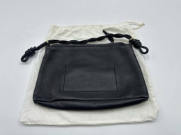 Women's black shoulder bag with white pouch 