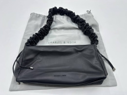 Women's black handbag with white pouch