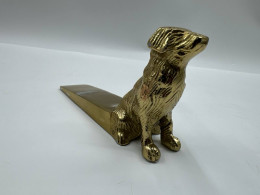 Golden dog door stopper