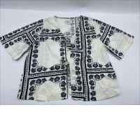 White short-sleeved shirt with black pattern White short-sleeved shirt with black pattern