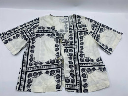 White short-sleeved shirt with black pattern White short-sleeved shirt with black pattern