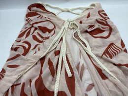 Pink off-shoulder dress with red stripes 