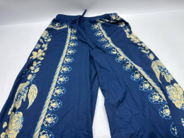 Women's blue trousers with gold pattern
