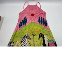 Women's long dress with a light brown tank top and horse pattern