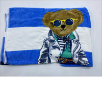 Blue towel with white stripes and a bear pattern 