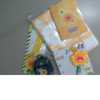 Jaidee A set of a backpack, a fabric keychain, a yellow towel, and two silicone bag keychains+notebook