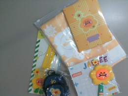 Jaidee A set of a backpack, a fabric keychain, a yellow towel, and two silicone bag keychains+notebook Jaidee A set of a backpack, a fabric keychain, a yellow towel, and two silicone bag keychains+notebook