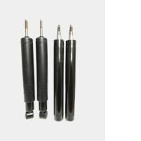 a set of four car shock absorbers