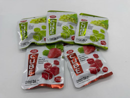 A set of five packs of chewing candies