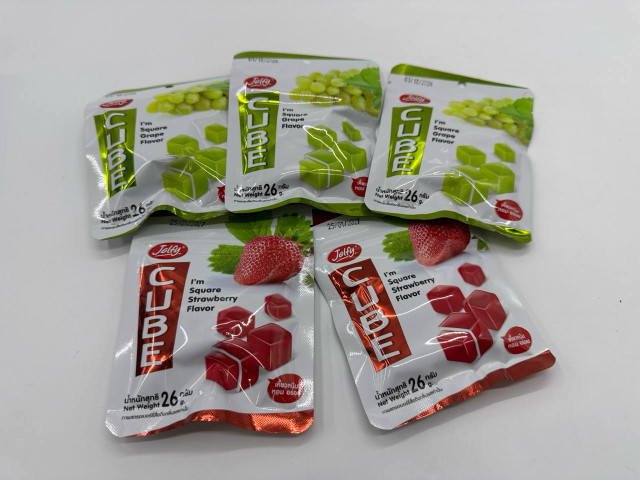 A set of five packs of chewing candies A set of five packs of chewing candies
