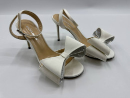 Women's white high heels with bow tie