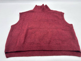 Women's red sleeveless turtleneck top