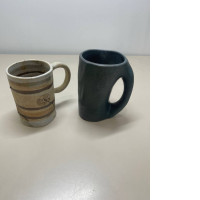 a set of two decorative mugs