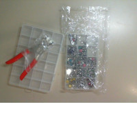 A set of 2 plastic containers + a special gun for riveting clothes and a set of riveting pins in different colors