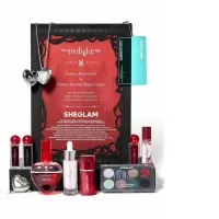 Sheglam cosmetics gift set. The set includes three lipsticks, a heart pendant, an eyeshadow palette, foundation, makeup remover serum, shimmery body lotion, and clear lip gloss.