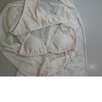 Beach set: beige two-piece swimsuit with cape and mesh skirt