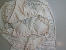 Beach set: beige two-piece swimsuit with cape and mesh skirt