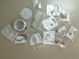 A craft kit, a spool of fishing line, and 12 bags of fasteners for making bracelets