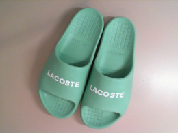 Green rubber Lacoste flip flops, replica
