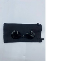 Black glasses for the truth in the black bag