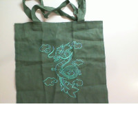 Green fabric bag with a dragon