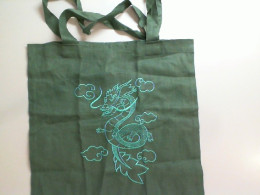 Green fabric bag with a dragon Green fabric bag with a dragon