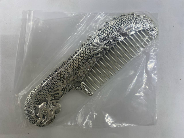 Silver stainless steel comb with koi fish pattern Silver stainless steel comb with koi fish pattern