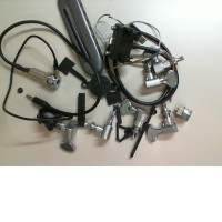 A set of parts for repairing a bass guitar, not new. A set of parts for repairing a bass guitar, not new.