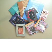 A set of photo cards featuring Korean pop stars