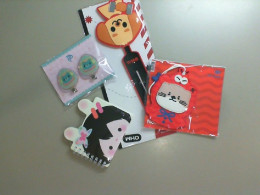 Set of 2 keychains, a notebook, a set of 2 hair clips