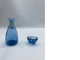 Blue glass water bottle and blue glass cup