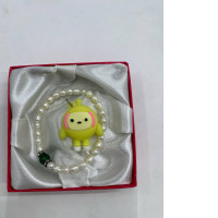 Beaded bracelet and doll pendant 