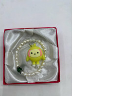 Beaded bracelet and doll pendant 