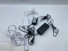 Set of 3 AC to DC power adapters and cables, used to power various electronic devices.