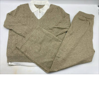 beige cable-knit sweater and knit lounge pants set. beige cable-knit sweater and knit lounge pants set.