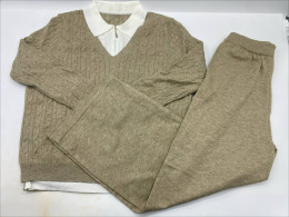  beige cable-knit sweater and knit lounge pants set. 