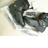 Black roller skates, disassembled (includes wheel hinges, mounting bolts, locking key, and wheels)