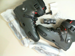 Black roller skates, disassembled (includes wheel hinges, mounting bolts, locking key, and wheels) Black roller skates, disassembled (includes wheel hinges, mounting bolts, locking key, and wheels)