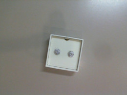 Stud earrings in a gift box