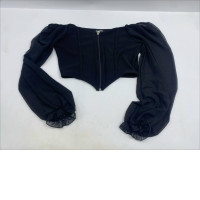 black long-sleeve corset crop top with a front zip closure and sheer ruffled cuffs. black long-sleeve corset crop top with a front zip closure and sheer ruffled cuffs.
