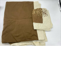 Cream-brown bedsheet and pillowcases