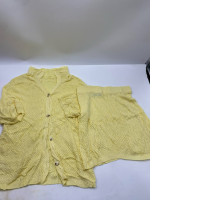 Women's yellow short-sleeved shirt and short skirt