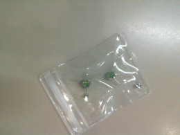 Stud earrings with a green stone