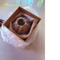 clay pot with a wooden box